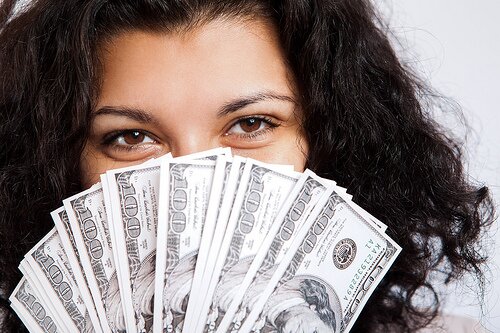 Money and Happiness, together at last. Image by Tax Credits at Flickr Commons